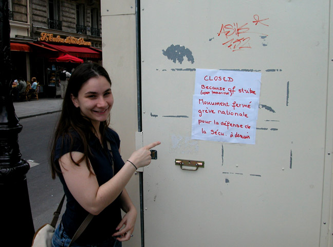 Lea pointing at sign